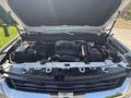 A 2017 Chevrolet Colorado with its hood raised displaying the engine compartment featuring various components and wiring
