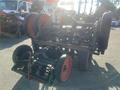 2017 R&R Reel with red and black wheels and a metal frame designed for agricultural use