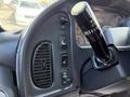 Interior dashboard of a 2011 Freightliner B2 featuring control buttons and a gear shift lever