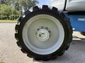 Close-up of a large tire from a 2012 Genie Z 45/25 with a metallic rim and rugged tread design