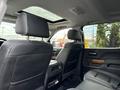 Interior view of a 2017 Chevrolet Silverado 1500 showing leather seats and a sunroof with a focus on the back seating area