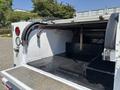 A 2017 Chevrolet Colorado with an open bed showing a metal surface and dividers for storage
