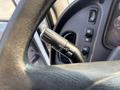 Close-up of the turn signal lever on a 2016 Freightliner M2 106 showing settings for off and full flush