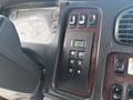 Dashboard controls of a 2010 Freightliner M2 106 featuring buttons for transmission settings and instrument gauges