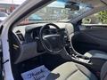 Interior of a 2015 Hyundai Sonata showing the dashboard steering wheel and seats with a thank you mat on the floor