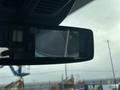 Rearview camera display showing the back of a 2021 Ford Transit-350 van with a clear view of the road behind
