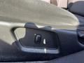 Close-up of a seat adjustment lever on the interior of a 2006 Pontiac G6
