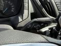 Close-up of the control stalk in a 2016 Ford Transit featuring various functions for wipers and turn signals on the steering column