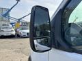 Close-up of the side mirror of a 2016 Ford Transit 150 showcasing its design and structure