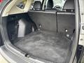 A 2014 Honda CR-V with a spacious and empty cargo area featuring a flat floor and rear seats in a folded position