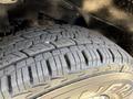 Close-up of a tire on a 2020 Chevrolet Express showcasing its tread pattern and sidewall detailing