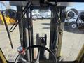 View from the cockpit of a 1993 Hyster H80XL forklift showing the steering wheel and front lifting forks