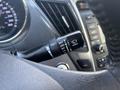 Close-up of a Hyundai Sonata steering column showing the windshield wiper control stalk with various settings labeled including mist off and front