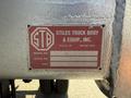 A metal plate displaying specifications for a Stiles Truck Body attached to a 2017 Ford F-650 Super Duty with model details and a serial number