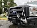 A 2015 Ford F-350 SD with a black grille featuring the Ford logo and chrome accents along with mounted lights and a hook on the front bumper
