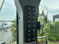 Control panel of a 2012 Caterpillar 980 featuring various buttons and switches for operating the machine