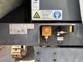 A 2018 Sandvik Ranger DX800 showing control panel with buttons and safety warnings including a respirator notice and a hazard symbol