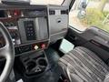 Interior view of a 2008 Kenworth T370 showing the dashboard with various controls and a driver's seat with patterned upholstery
