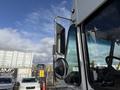 2017 Freightliner MT45 with a prominent side mirror and chrome detailing showcasing its commercial design and sturdy build