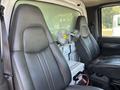 Interior view of a 2007 GMC C4500 TopKick showing two leather seats and a small fan positioned between them