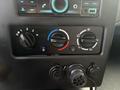 Control panel with dials for temperature and airflow adjustment featuring climate control buttons and USB and electrical sockets