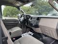 Interior of a 2010 Ford F-550 Super Duty featuring gray seats and controls on the dashboard