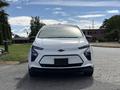 A white 2023 Chevrolet Bolt EV with a sleek front design featuring the Chevrolet logo and distinctive headlights