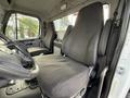 Interior of a 2015 Freightliner M2 showing two gray cloth seats and steering wheel