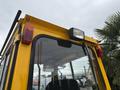 A yellow 2004 Bombardier SW48 industrial vehicle with a high-mounted light and rear lights visible near the roof