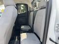 Interior view of a 2017 Chevrolet Colorado showing the rear seats with gray upholstery and a central armrest compartment