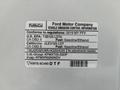 A 2019 Ford F-150 with a vehicle emission control information label detailing regulatory compliance and gasoline/ethanol usage