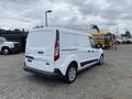 A white 2017 Ford Transit Connect van parked with its rear view visible and a plain design featuring sliding side doors and medium-sized wheels