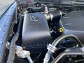 Close-up of the engine compartment of a 2017 RAM 1500 showcasing the air intake and engine cover with the RAM logo prominently displayed
