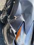 A 2017 Nissan Murano with a noticeable dent and scratches on the side panel near the rear wheel arch