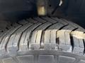 Close-up of a tire from a 2018 Ford Transit-350 showing tread patterns and sidewall details