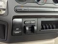 Control panel of a 2008 Ford F-250 SD featuring knobs for air conditioning and buttons for gain and output adjustments