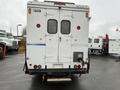 A 2012 Workhorse W62 cargo truck with a white exterior featuring a rear door setup and a rectangular hitch at the bottom