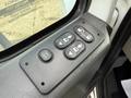 Control panel for windows and doors in a 2014 International TerraStar with buttons for door operation power windows and lock functions