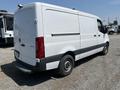 2022 Mercedes-Benz Sprinter van in white with a smooth exterior large cargo area and black trim along the bottom