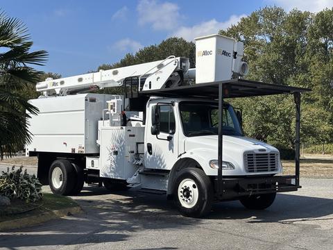 A white 2019 Freightliner M2 106 utility truck equipped with a boom lift and storage compartments on the side