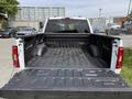 White 2021 Ford F-150 truck bed with a textured black liner and no visible cargo
