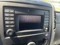 Dashboard display of a 2016 Mercedes-Benz Sprinter showing a parking assist screen with guidelines and a message to check entire surroundings