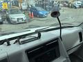 Interior view of a 1994 GMC Vandura 3500 dashboard featuring a radio display and a flexible lamp mounted on the instrument panel