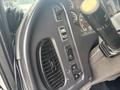 Dashboard controls and knobs of a 2006 Freightliner M2 106 including buttons for lights air conditioning and various other functions
