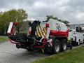 A red and white 2020 Pottinger Impress agricultural baler with large wheels and attached equipment visible at the rear