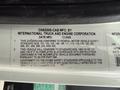 A label on a 2006 International 4200 truck indicating compliance with federal motor vehicle safety standards and providing vehicle specifications and manufacturing details