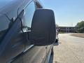 Side view mirror of a 2016 Ford Transit 150 vehicle