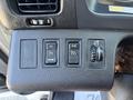 Close-up of the control panel in a 2020 Hino 338 featuring buttons for setting and resuming cruise control with a dial for adjusting settings