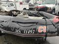 A black 2009 ShoreLandr ANDER inflatable boat with visible wear and tear featuring a gray interior and registration numbers C5 314 11497