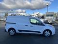 A white 2017 Ford Transit Connect van is parked with a roof rack and side windows visible showcasing its compact design and practical features